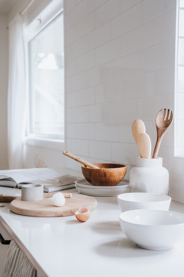 White Ceramic Plates and Bowls on White Kitchen Countertop